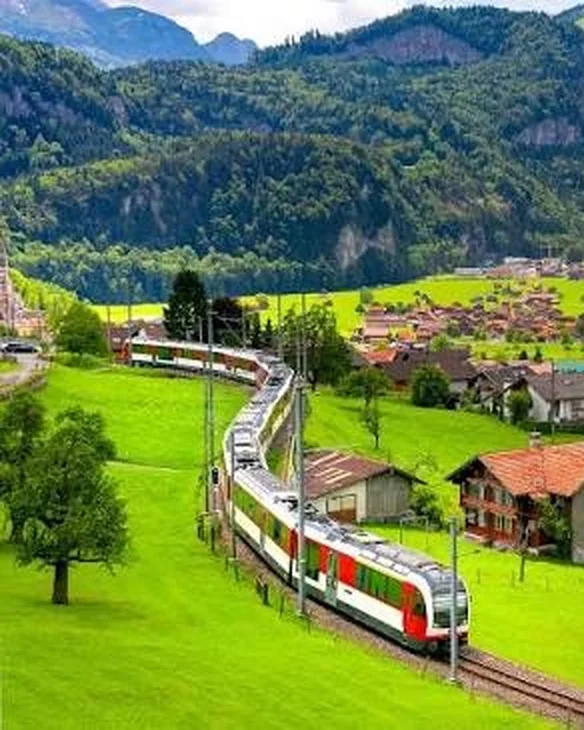 Train on the Brünig line above Lake Lungern, the route of the Lucerne–Interlaken Express, Switzerland.
