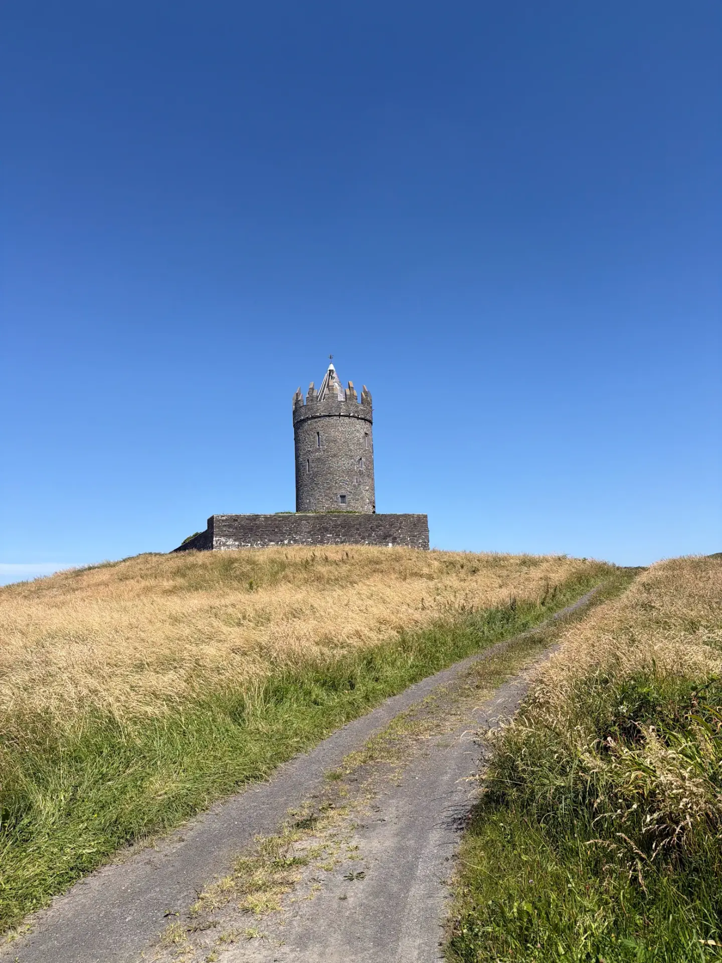 Doonagore Castle tower on a hill above Doolin, Ireland
