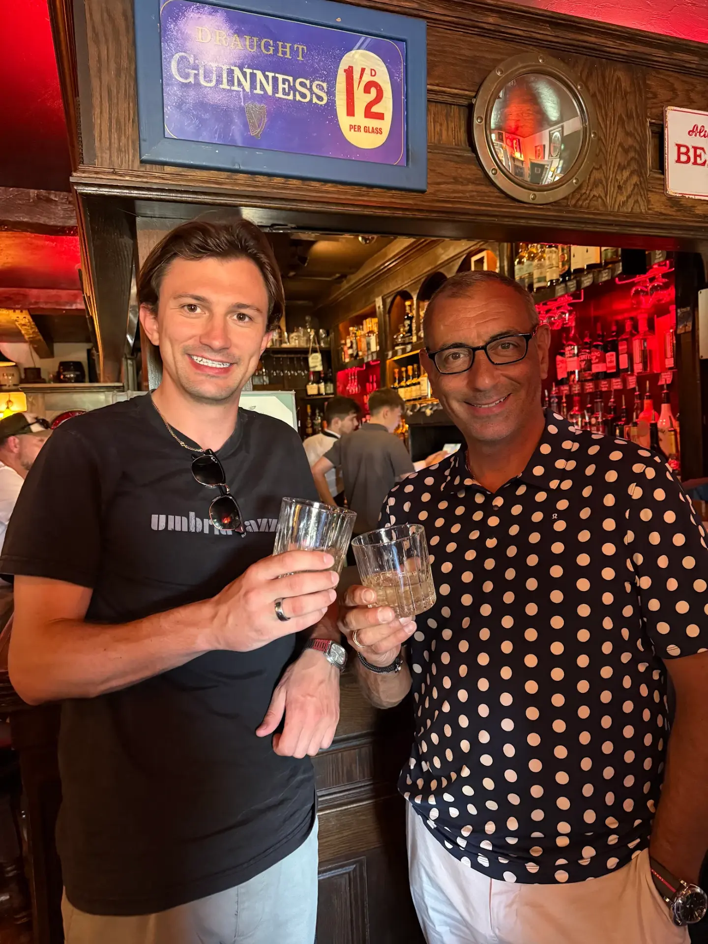 Riccardo and his friend with pints at a pub in Ireland