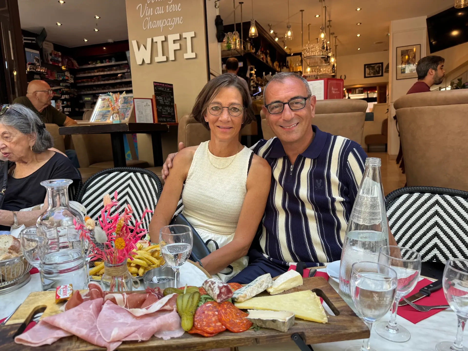 Riccardo and his wife at a bistro dinner in Paris, France