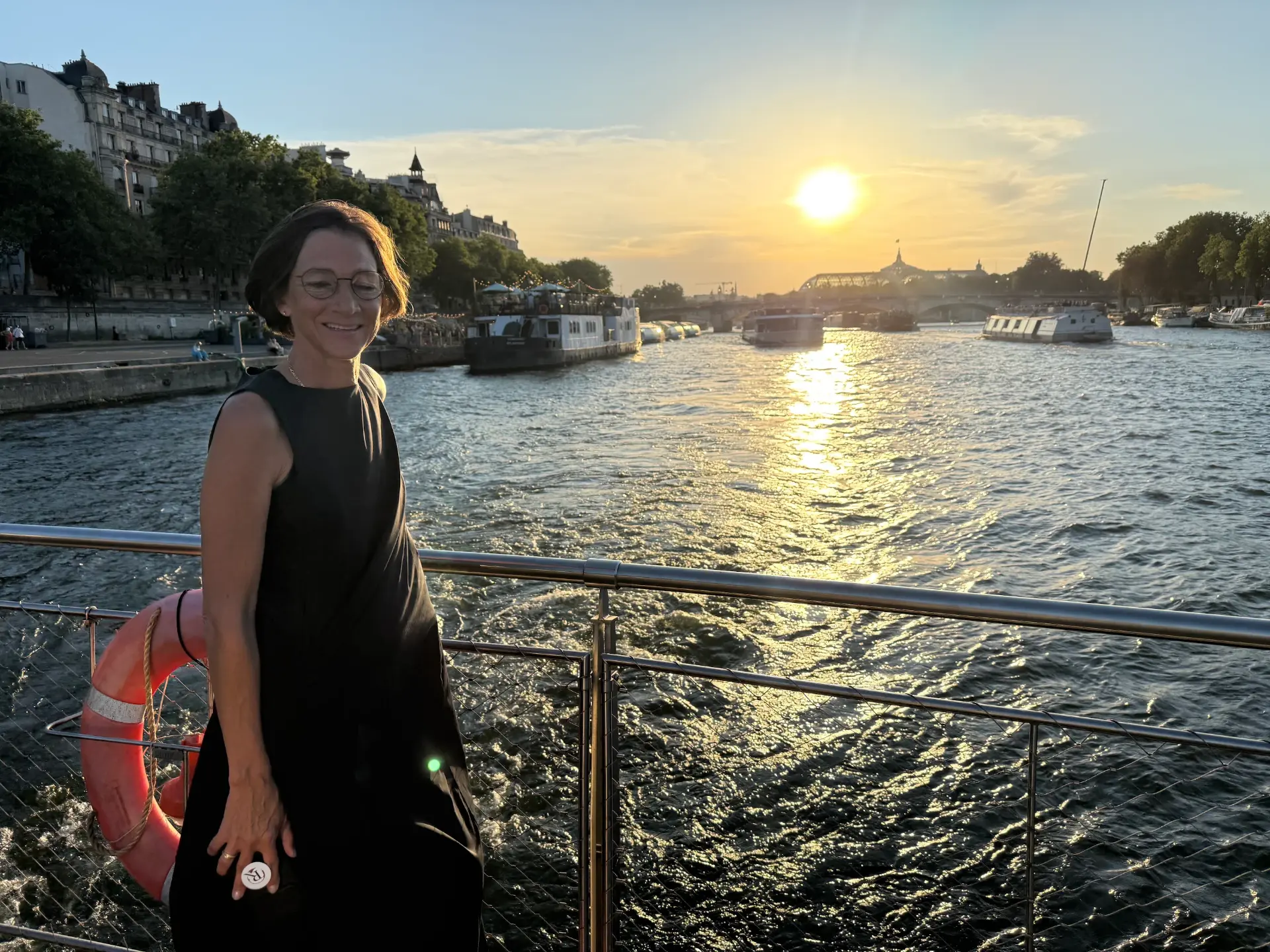 Riccardo's wife on a Seine River dinner cruise at sunset in Paris, France