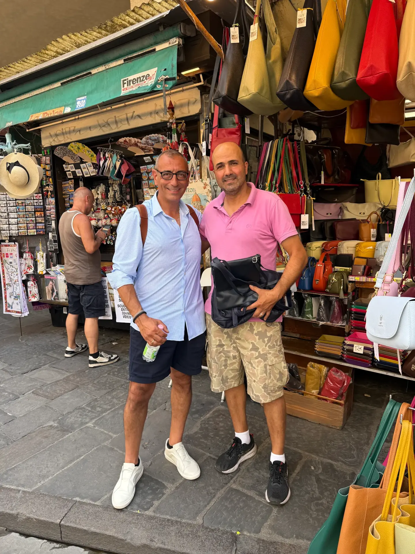 Riccardo and his friend at the leather market in Florence, Italy
