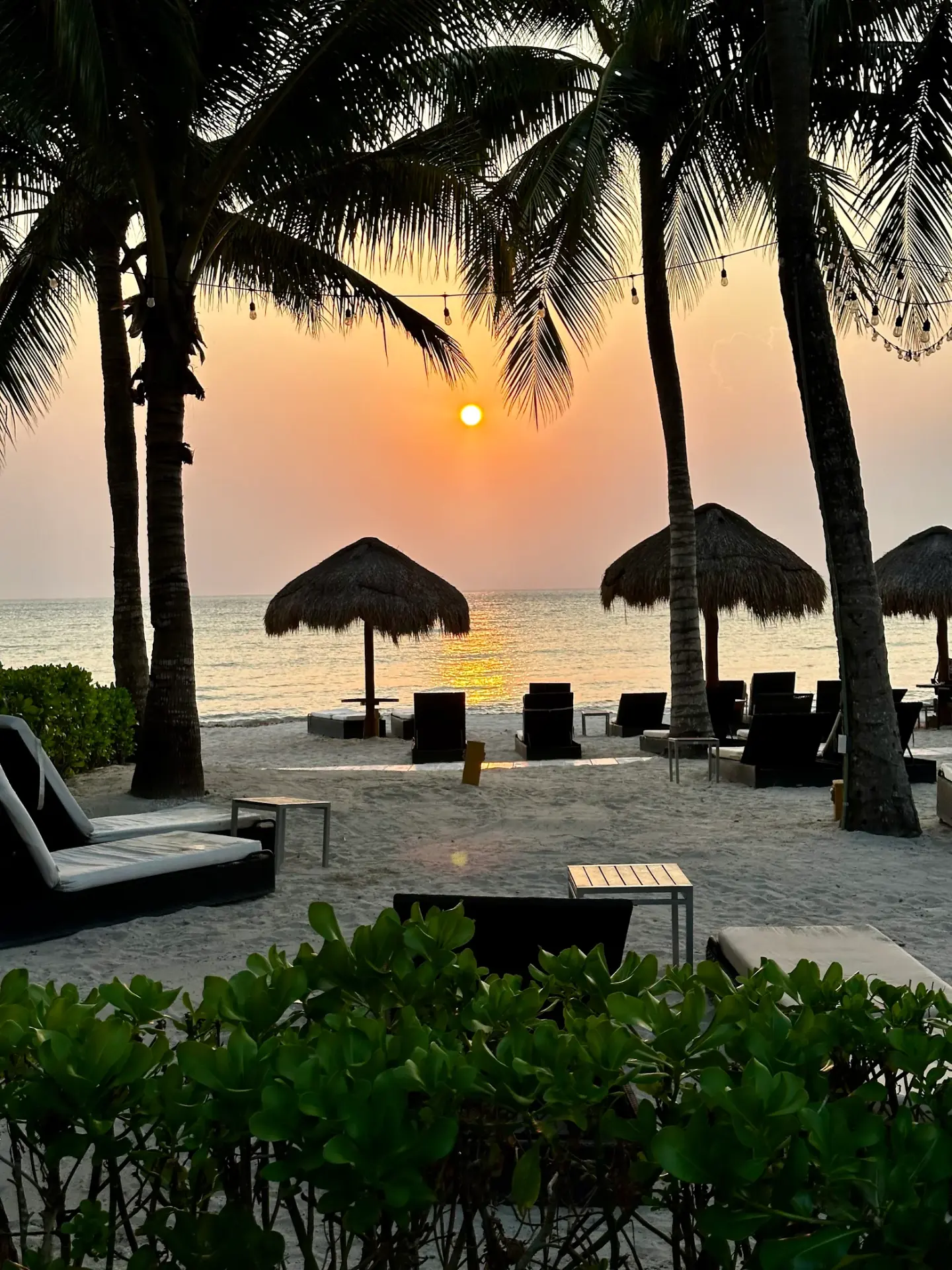 Sunset over the beach club at Cozumel, Mexico, on a group trip planned by Paradise Travel