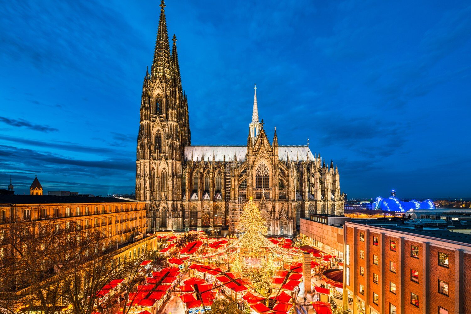 Christmas market at night beside Cologne Cathedral on a Rhine river cruise